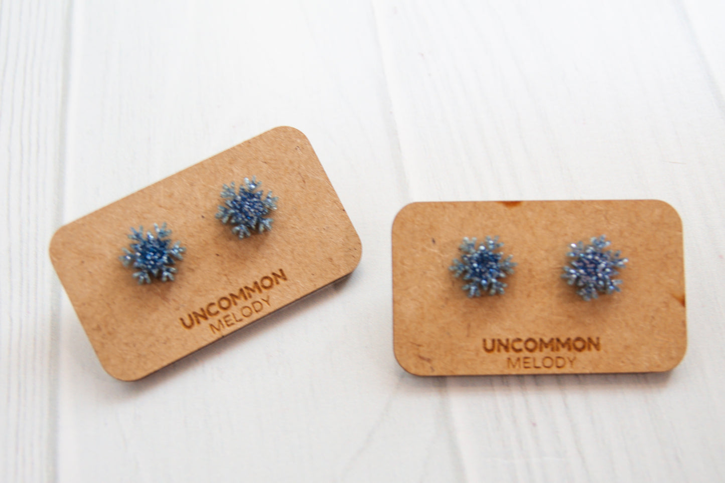 Sparkling Blue Snowflake Stud Earrings